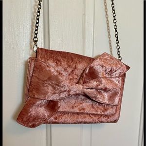 Pink, velvet handbag/clutch by Anthropologie with bow detail